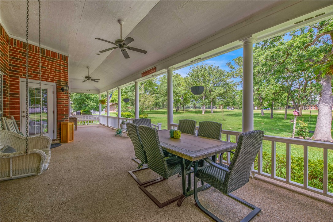 7 Hickory Ridge Lane Hilltop Lakes, TX 77871 - Photo 31 of 37 a view of a patio with a table chairs and a backyard