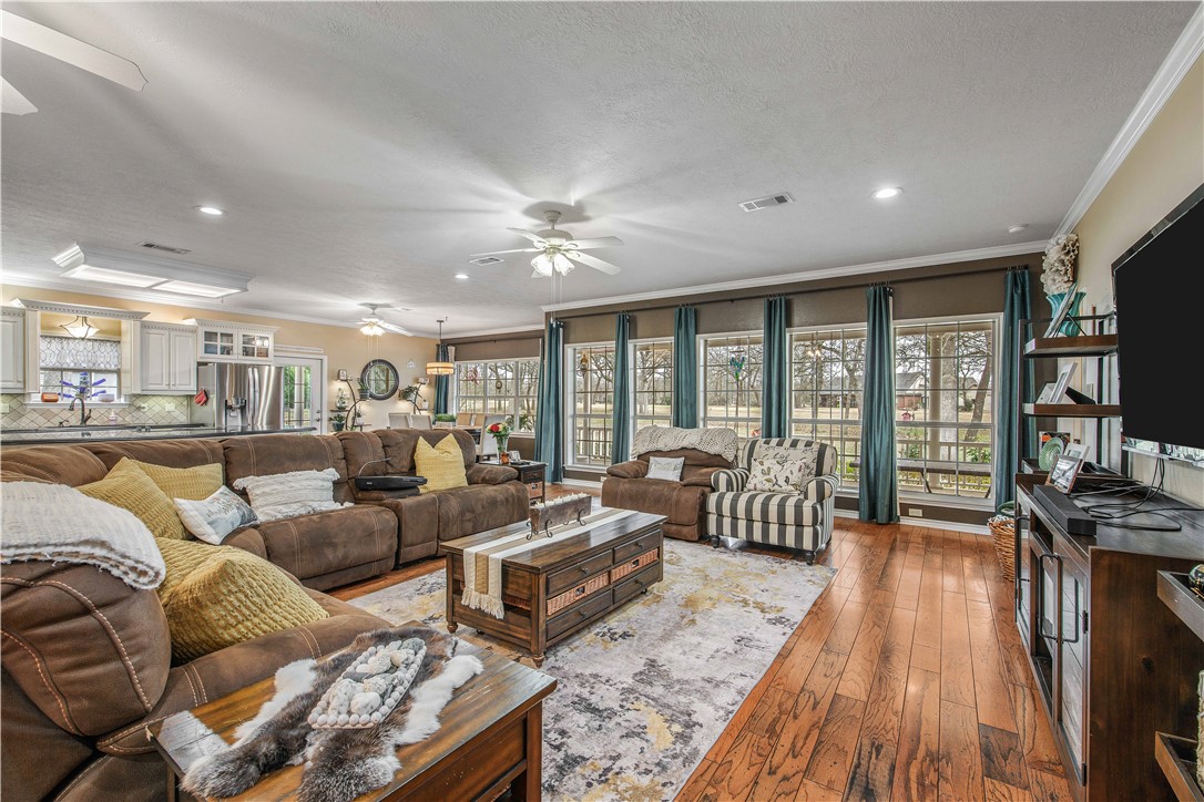 7 Hickory Ridge Lane Hilltop Lakes, TX 77871 - Photo 10 of 37 a living room with furniture fireplace and flat screen tv