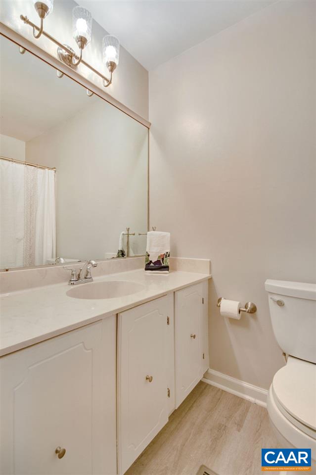 101 Vincennes Road Charlottesville, VA 22911 - Photo 14 of 31 a bathroom with a toilet sink and mirror