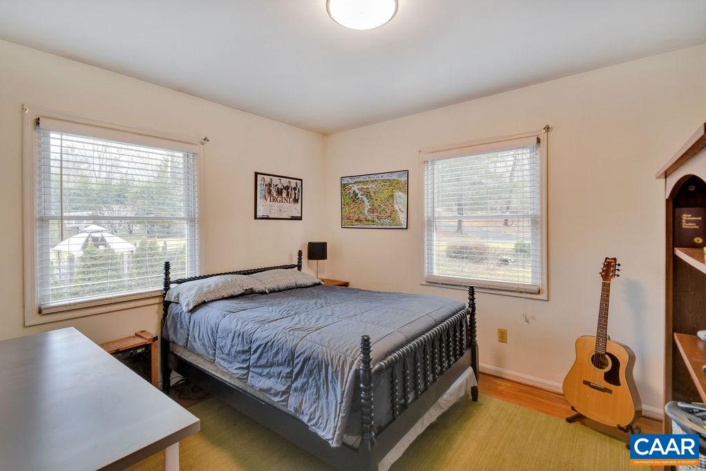 101 Vincennes Road Charlottesville, VA 22911 - Photo 15 of 31 a bedroom with a bed window and a table in it