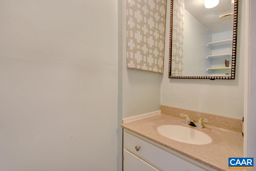 101 Vincennes Road Charlottesville, VA 22911 - Photo 21 of 31 a bathroom with a sink and a mirror