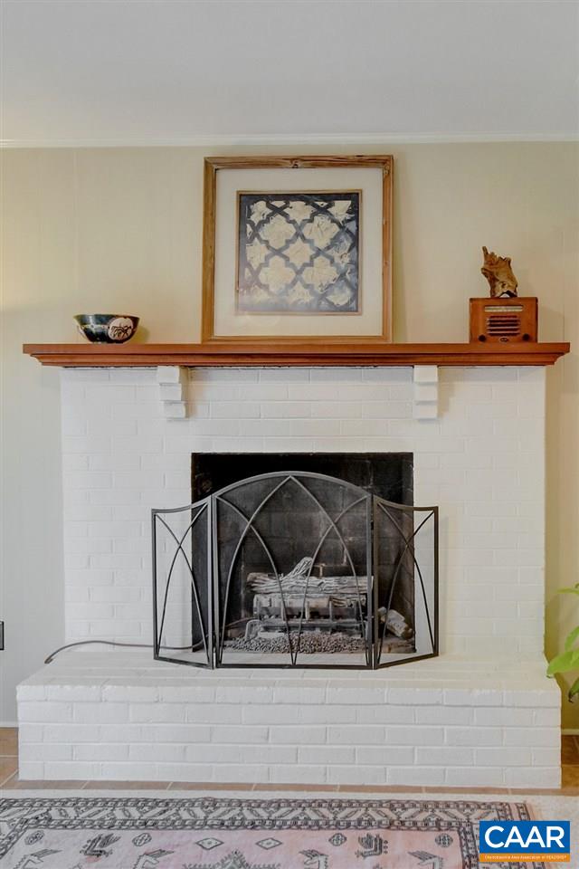 101 Vincennes Road Charlottesville, VA 22911 - Photo 23 of 31 a living room with furniture and a fireplace