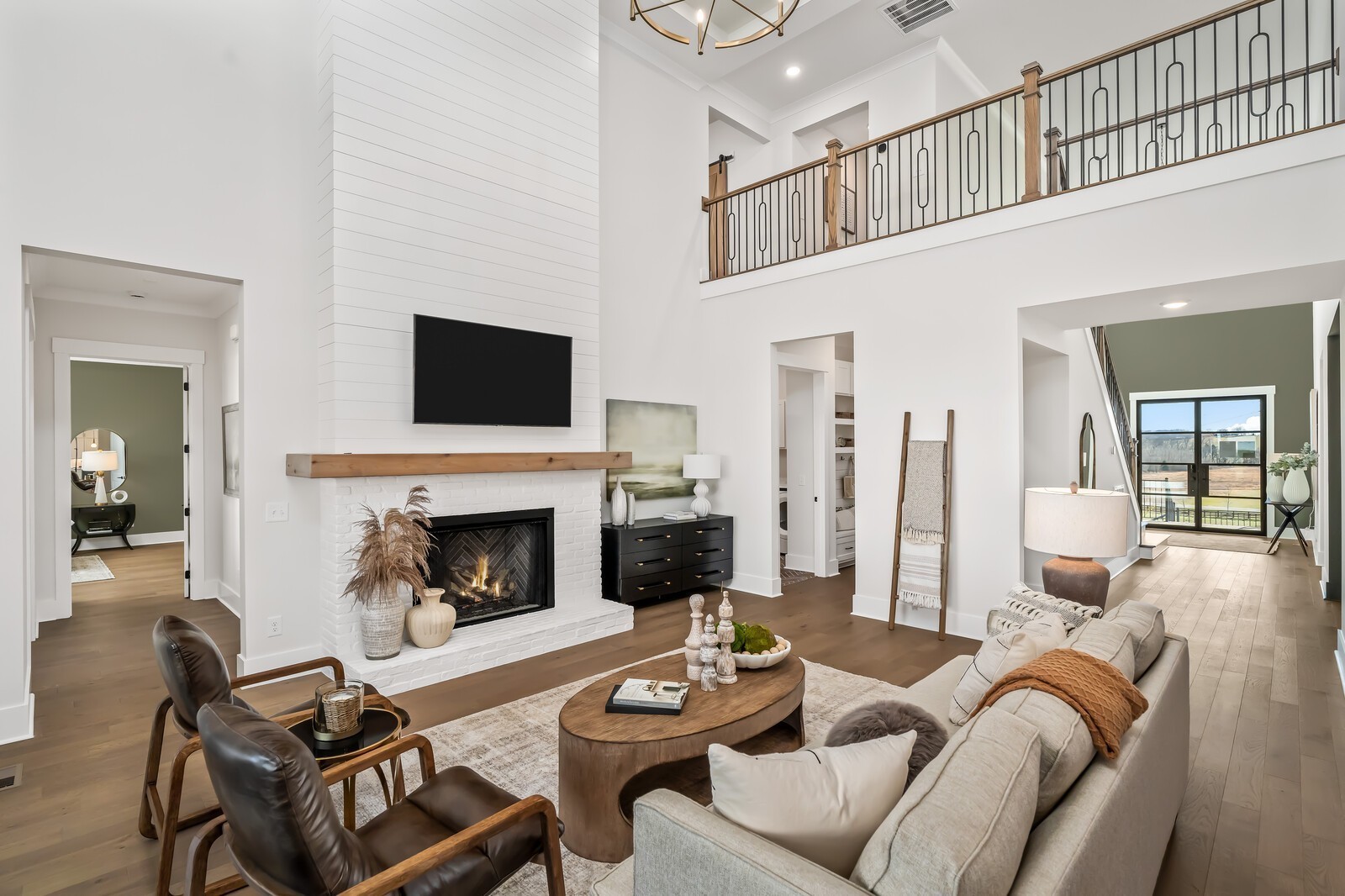 7280 Ruzek Court Fairview, TN 37062 - Photo 22 of 90 a living room with furniture a flat screen tv and a fireplace