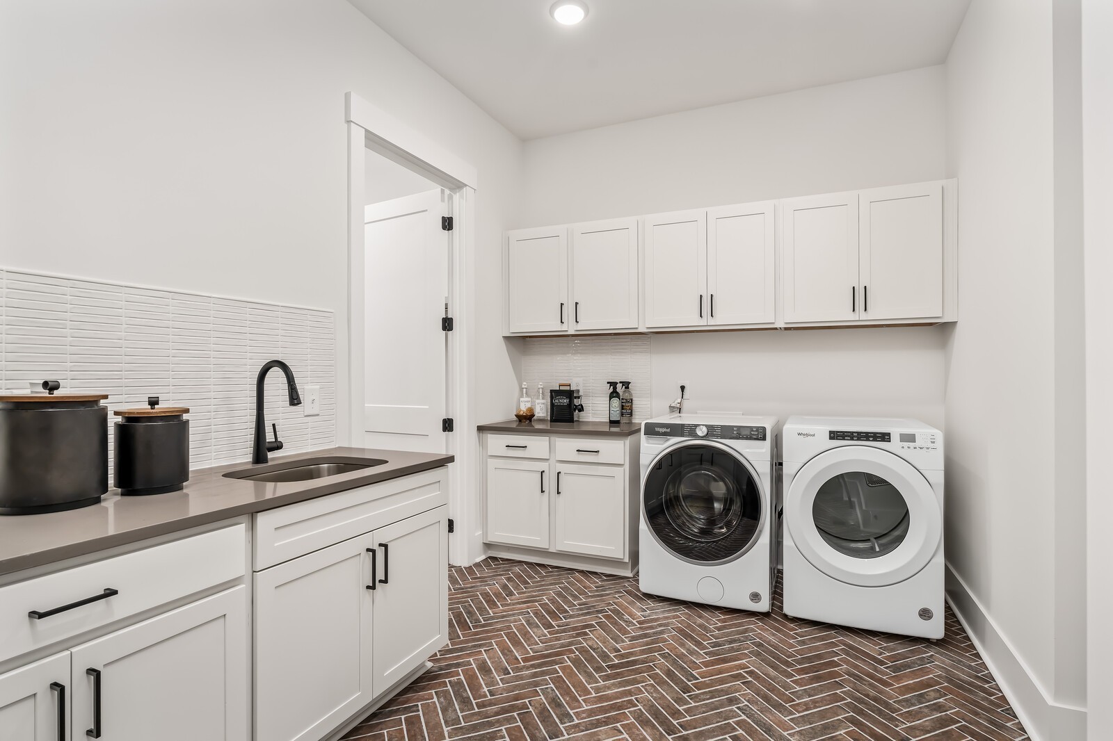 7280 Ruzek Court Fairview, TN 37062 - Photo 41 of 90 a kitchen with white cabinets and stainless steel appliances