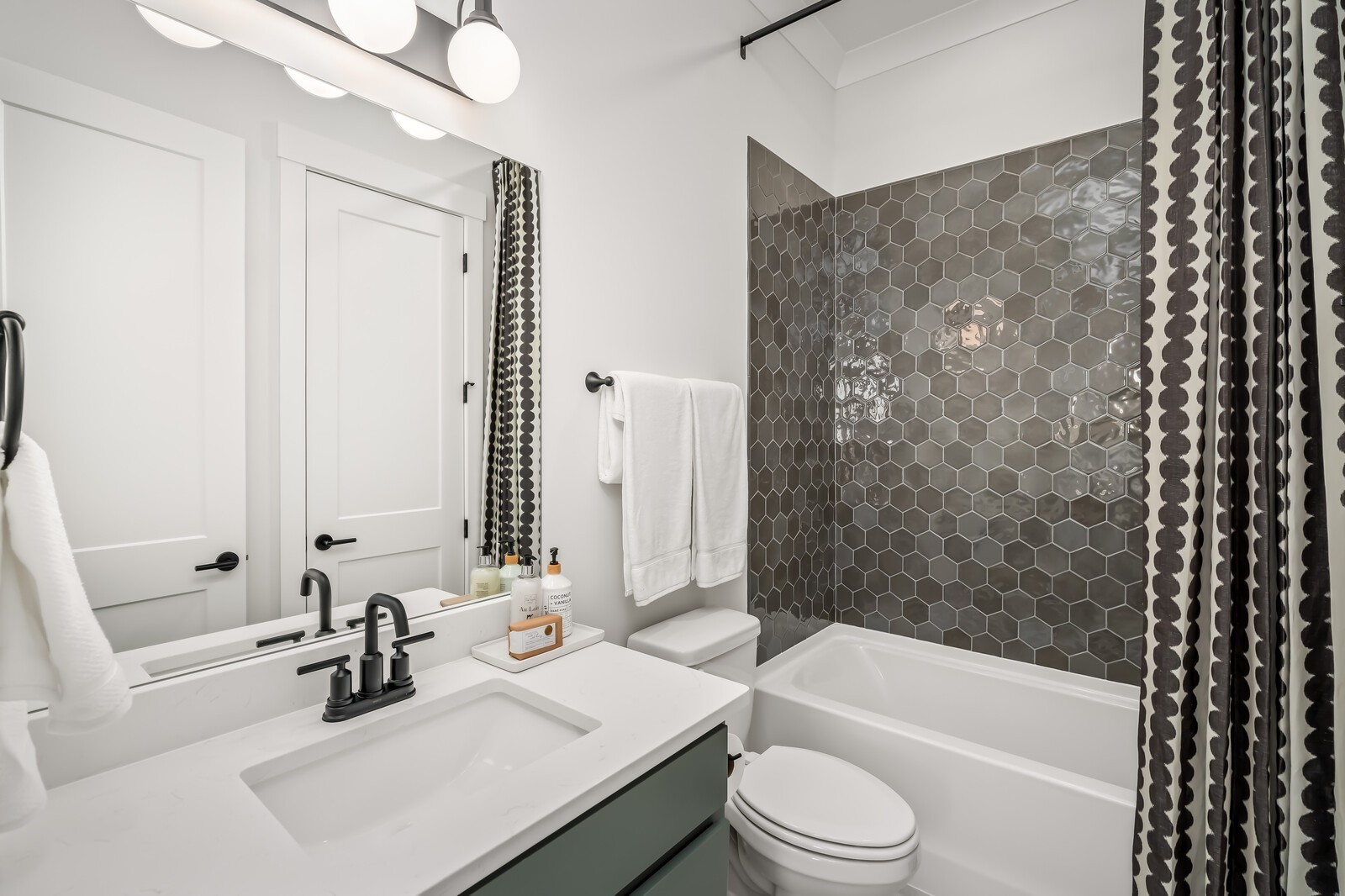 7280 Ruzek Court Fairview, TN 37062 - Photo 60 of 90 a bathroom with a sink a toilet and shower