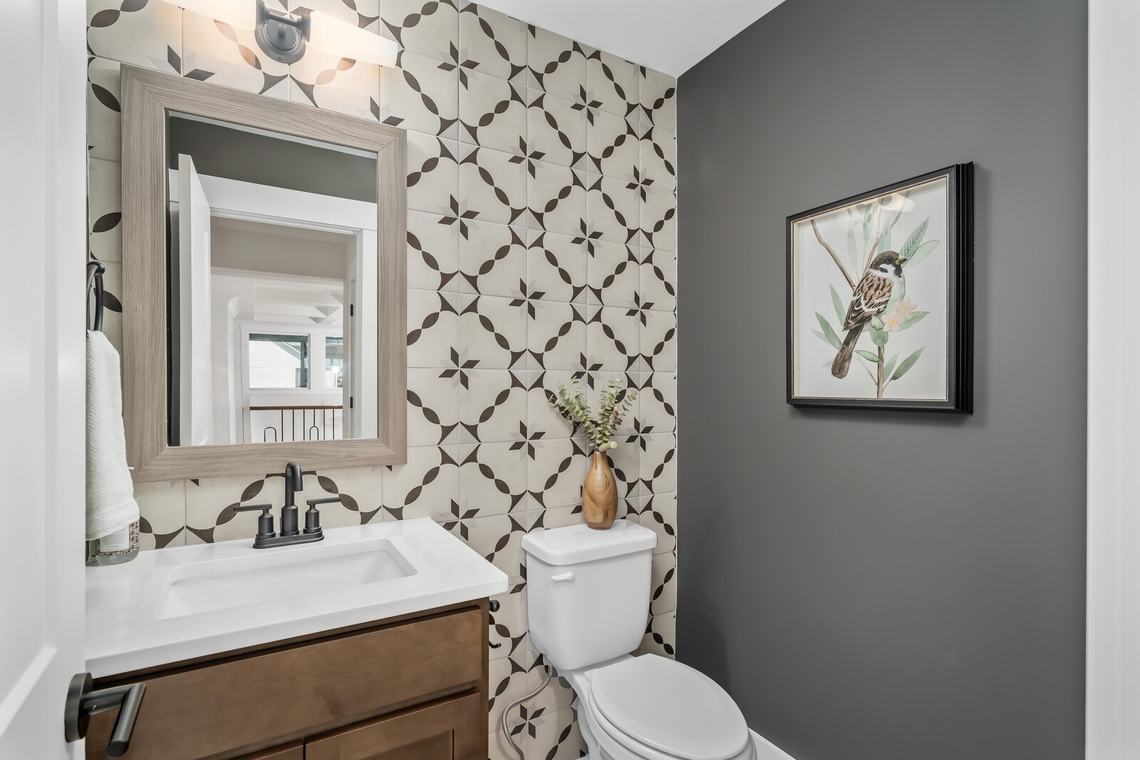 7280 Ruzek Court Fairview, TN 37062 - Photo 76 of 90 a bathroom with a sink a toilet and mirror