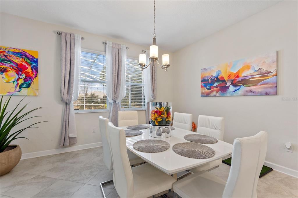 8811 Bally Neal Loop Davenport, FL 33896 - Photo 15 of 82 a dining room with furniture and window