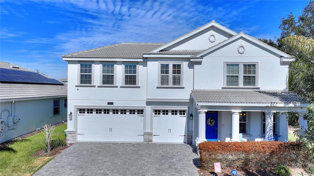 8811 Bally Neal Loop Davenport, FL 33896 - Photo 2 of 82 a front view of a house with a yard