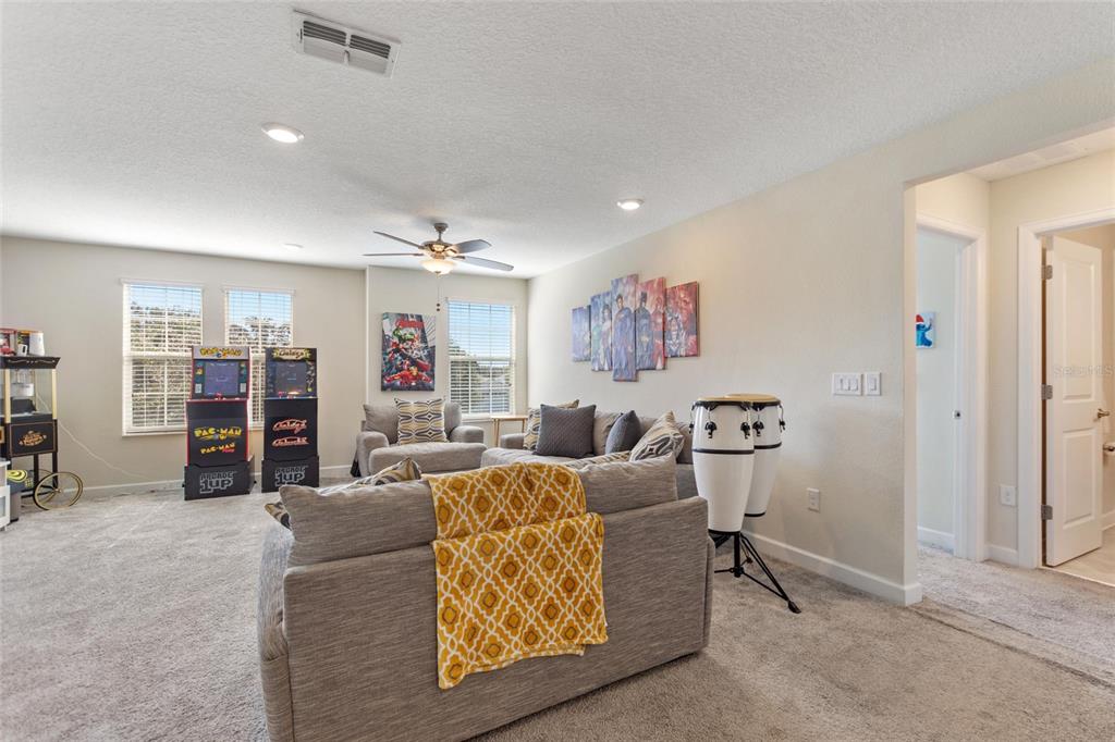 8811 Bally Neal Loop Davenport, FL 33896 - Photo 27 of 82 a living room with furniture and closet