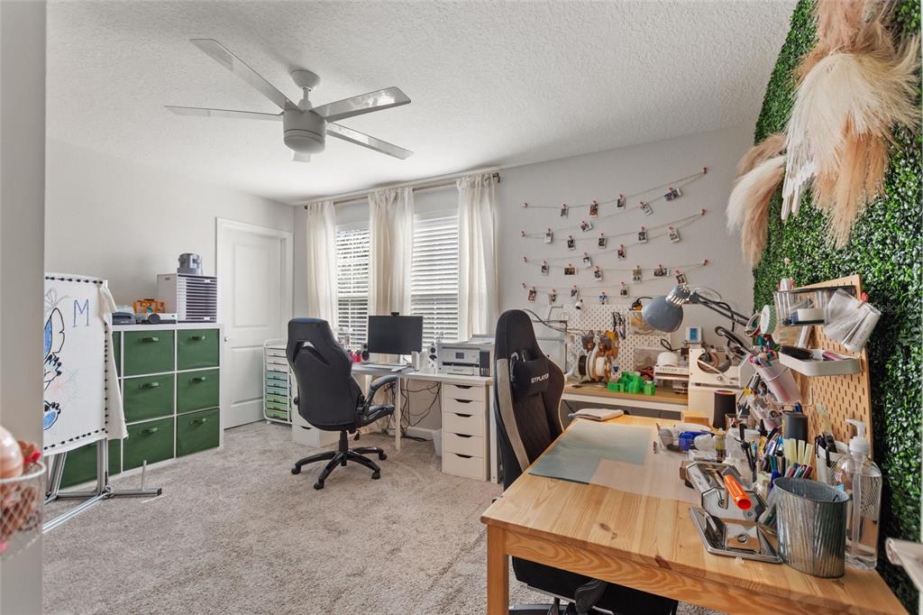 8811 Bally Neal Loop Davenport, FL 33896 - Photo 35 of 82 a view of a workspace with furniture