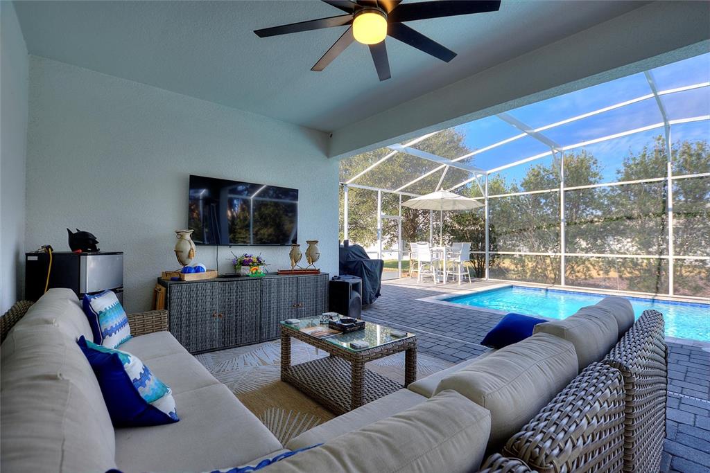 8811 Bally Neal Loop Davenport, FL 33896 - Photo 4 of 82 a living room with furniture and a flat screen tv
