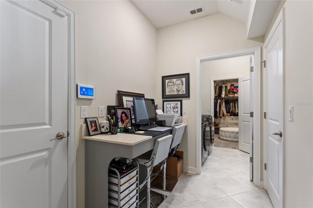 8811 Bally Neal Loop Davenport, FL 33896 - Photo 43 of 82 a view of a workspace with furniture and a window