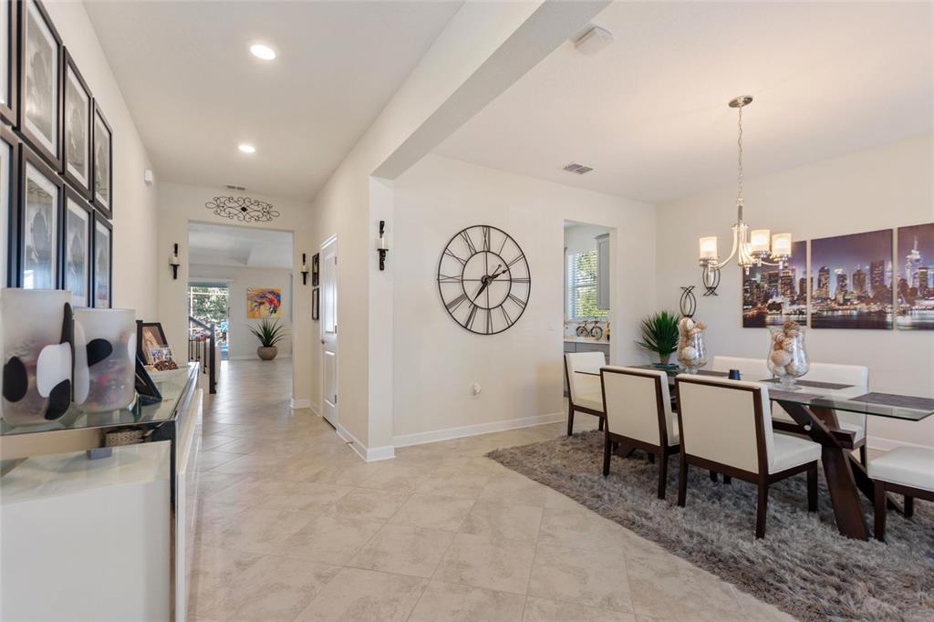8811 Bally Neal Loop Davenport, FL 33896 - Photo 7 of 82 a view of a dining area with furniture and a large window