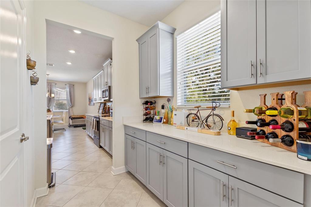 8811 Bally Neal Loop Davenport, FL 33896 - Photo 10 of 82 a view of a kitchen with furniture and cars