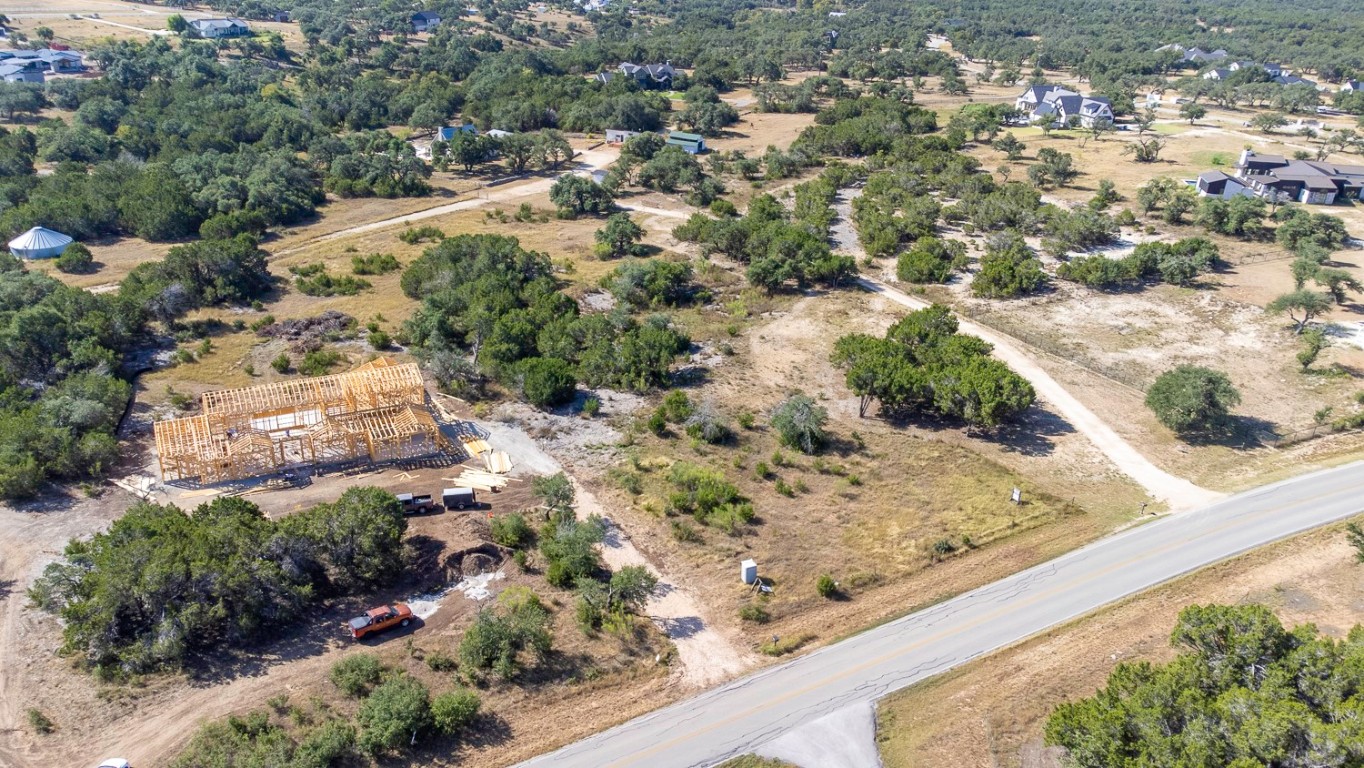 2251 West Fitzhugh Road Dripping Springs, TX 78620 - Photo 3 of 16 a view of a yard with wooden fence