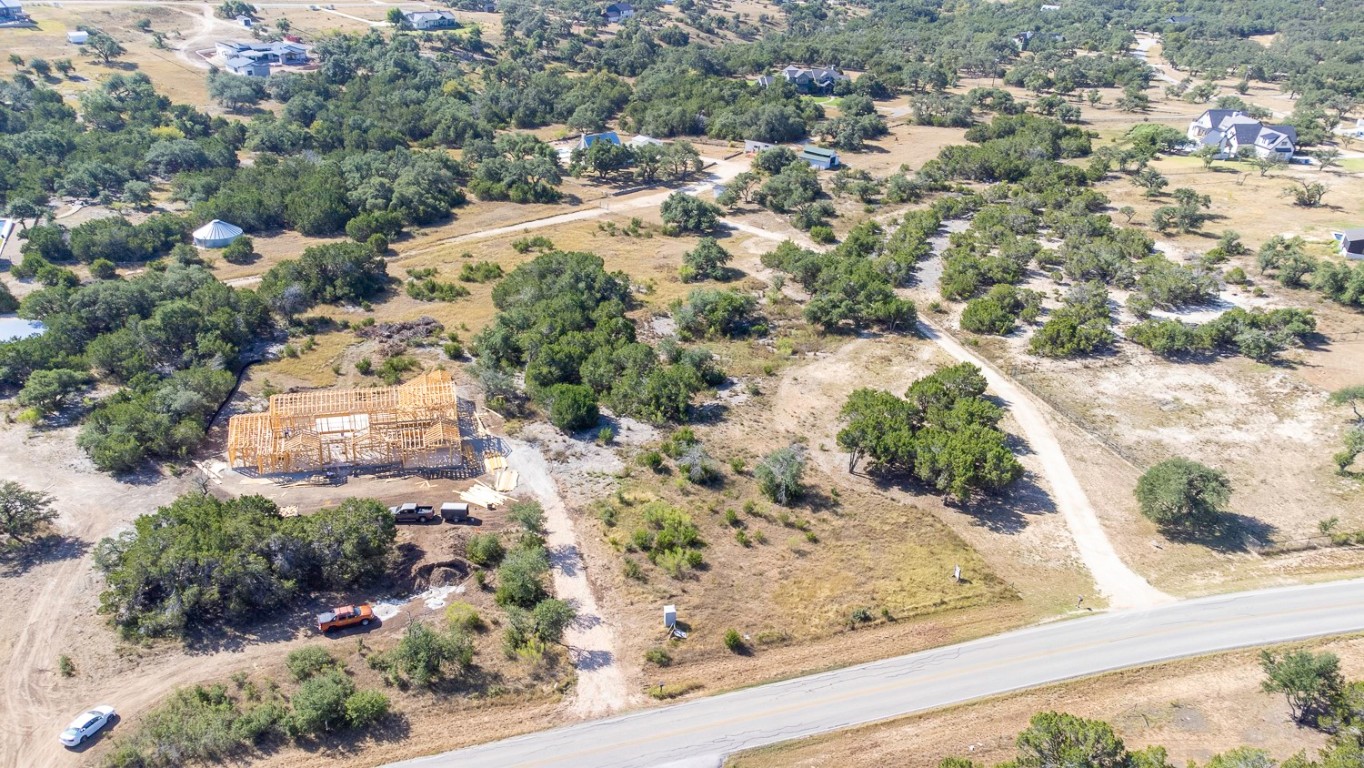 2251 West Fitzhugh Road Dripping Springs, TX 78620 - Photo 4 of 16 an aerial view of a house with a yard and large tree