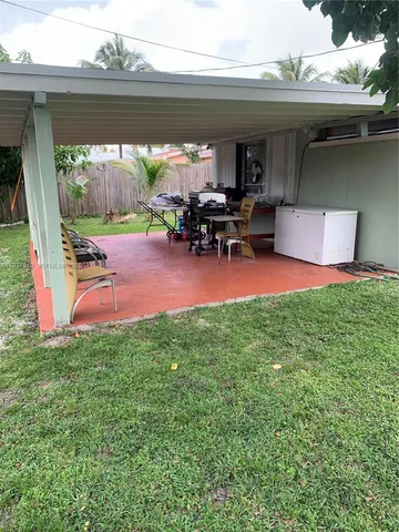 a patio with table and chairs