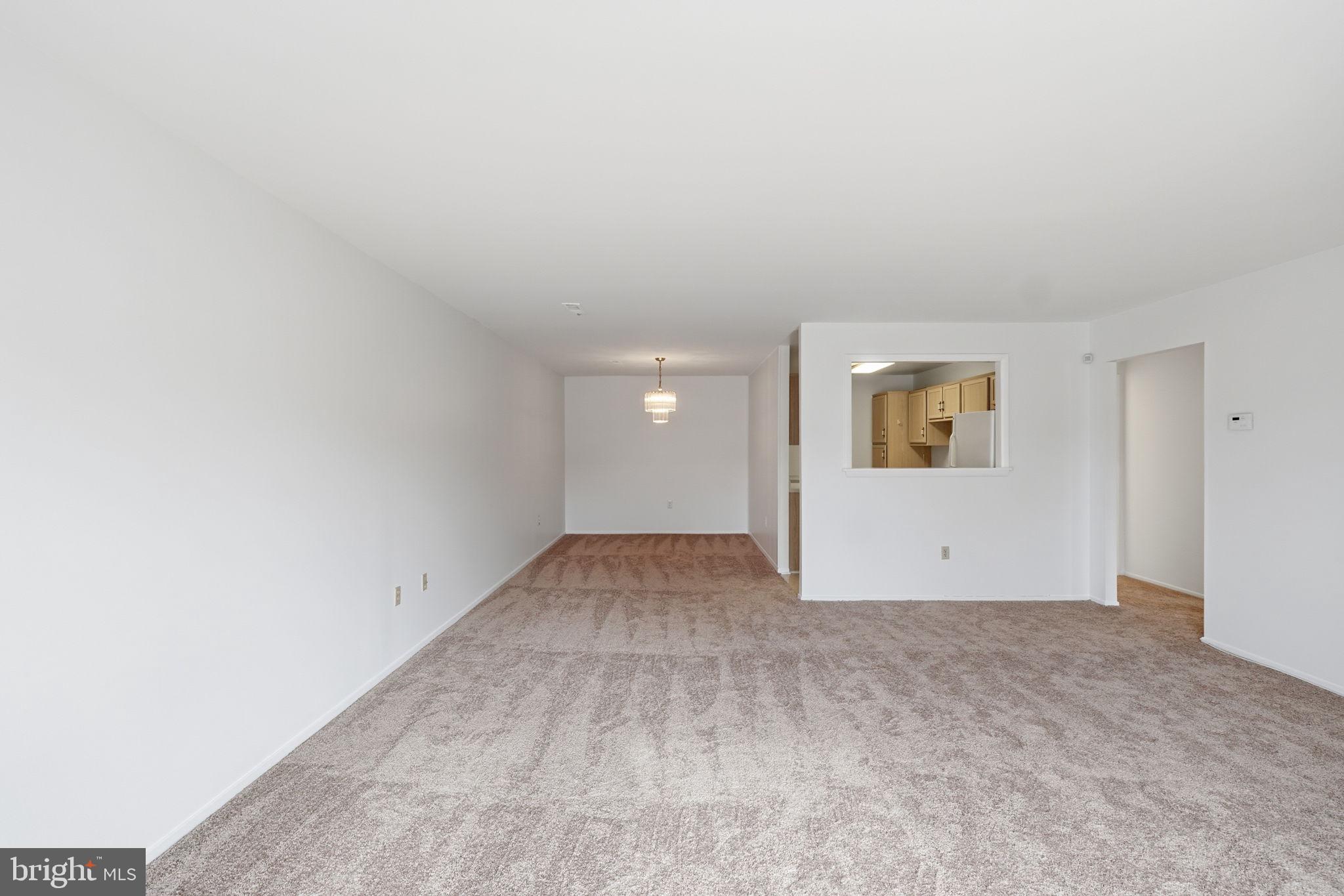 3103 Beckenham Court, Unit 252D Silver Spring, MD 20906 - Photo 13 of 32 an empty room with a empty space and window