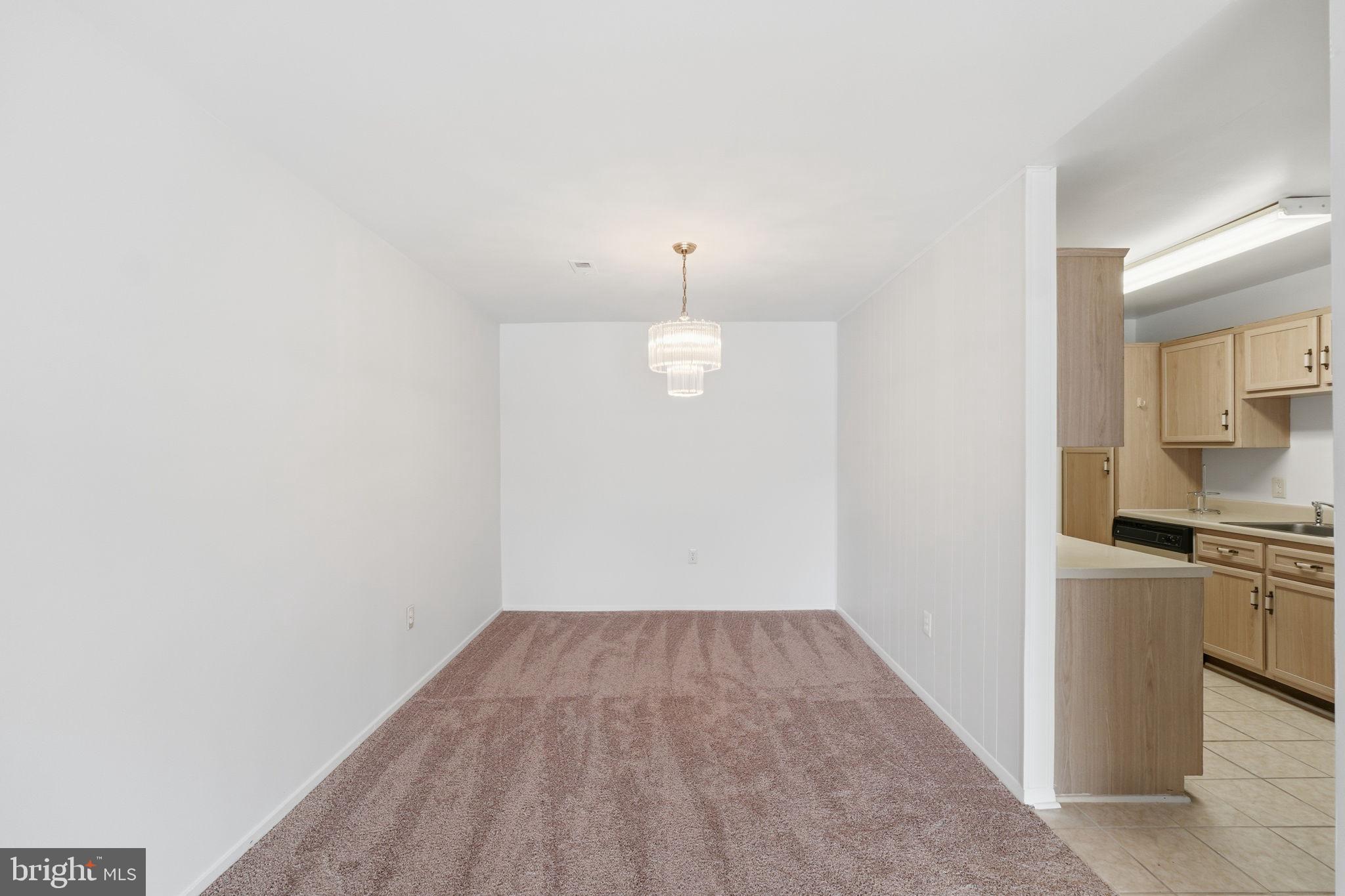 3103 Beckenham Court, Unit 252D Silver Spring, MD 20906 - Photo 14 of 32 a view of a room with wooden floor and a sink