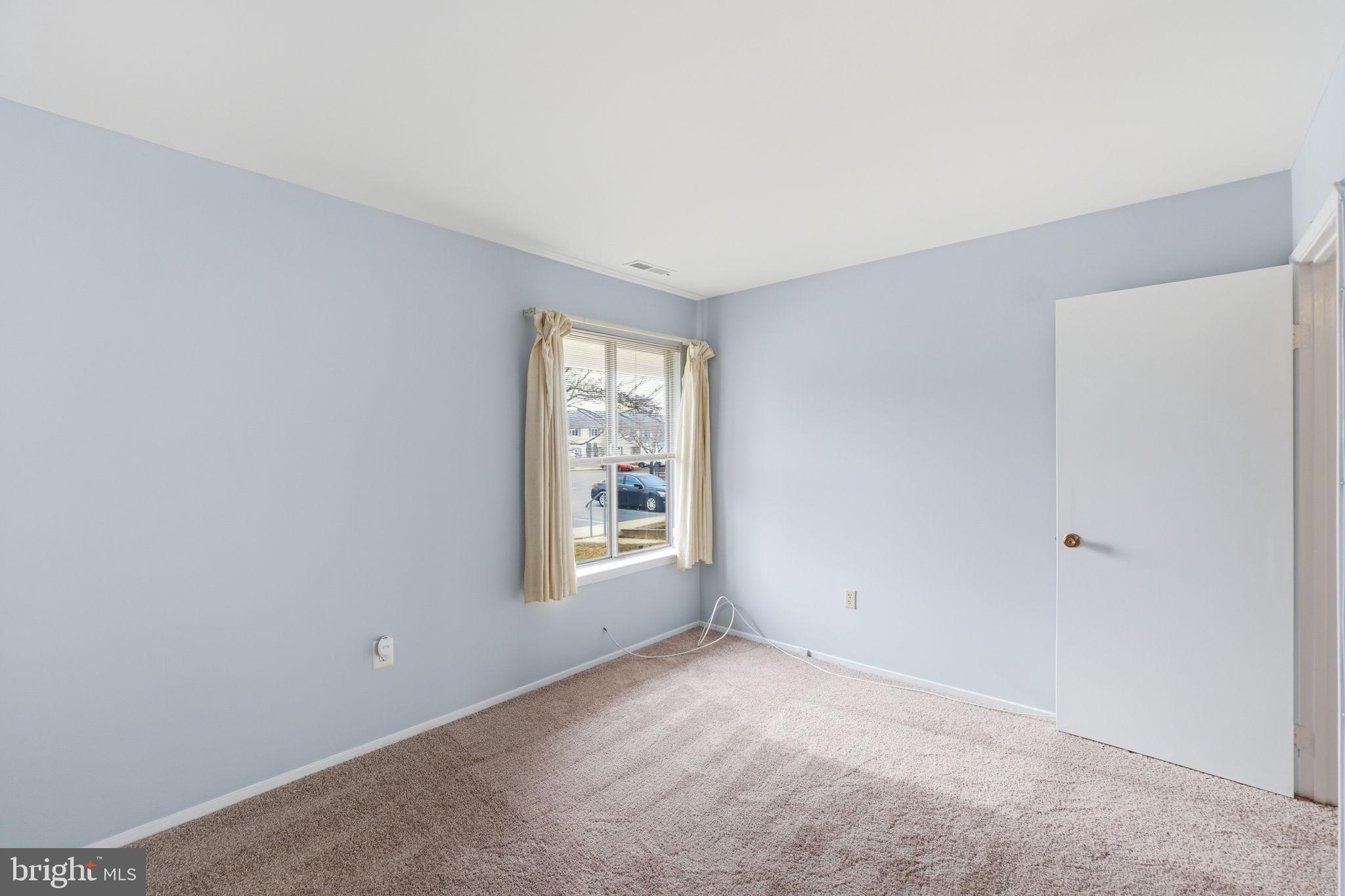 3103 Beckenham Court, Unit 252D Silver Spring, MD 20906 - Photo 22 of 32 an empty room with windows