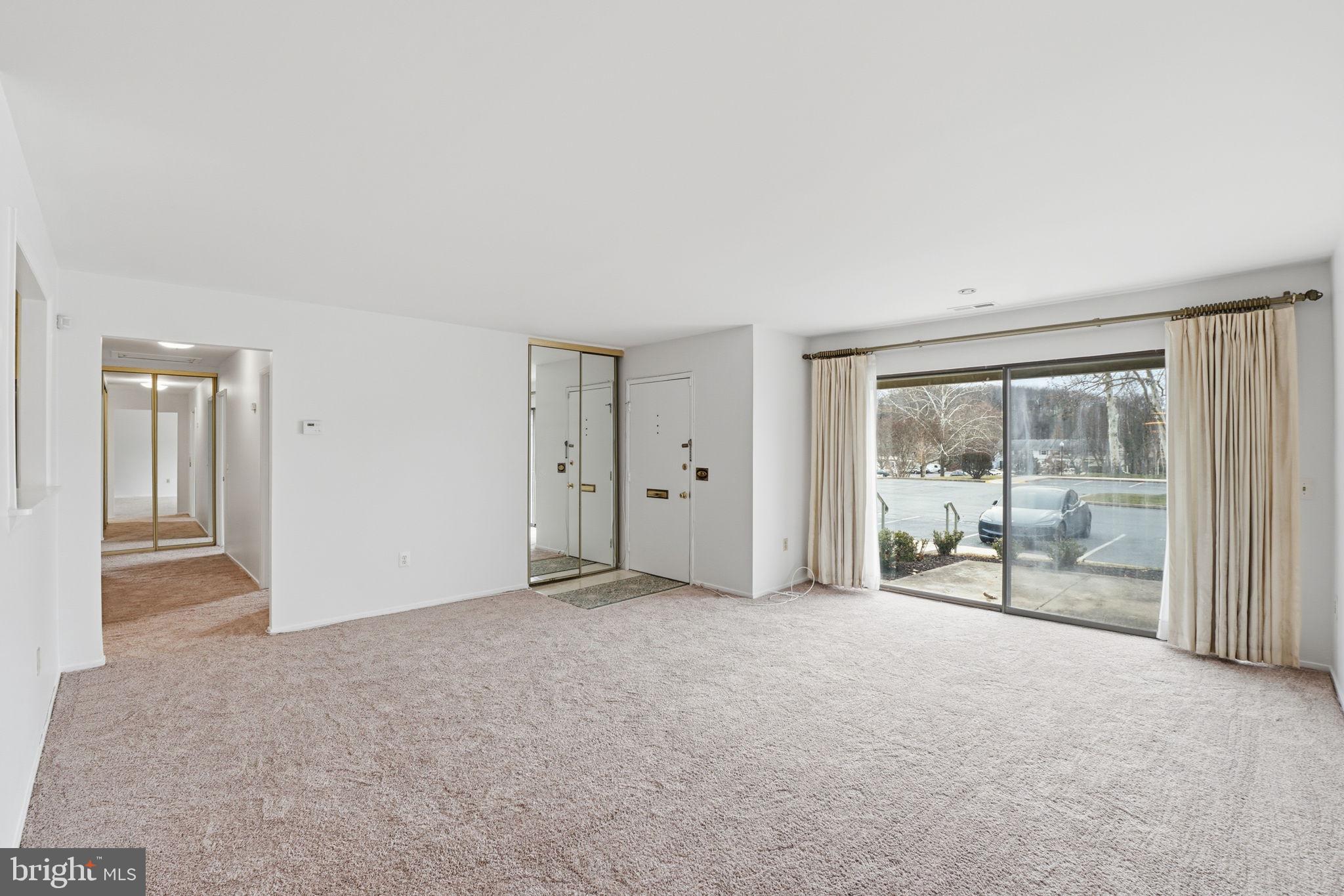 3103 Beckenham Court, Unit 252D Silver Spring, MD 20906 - Photo 5 of 32 a view of an empty room with a window