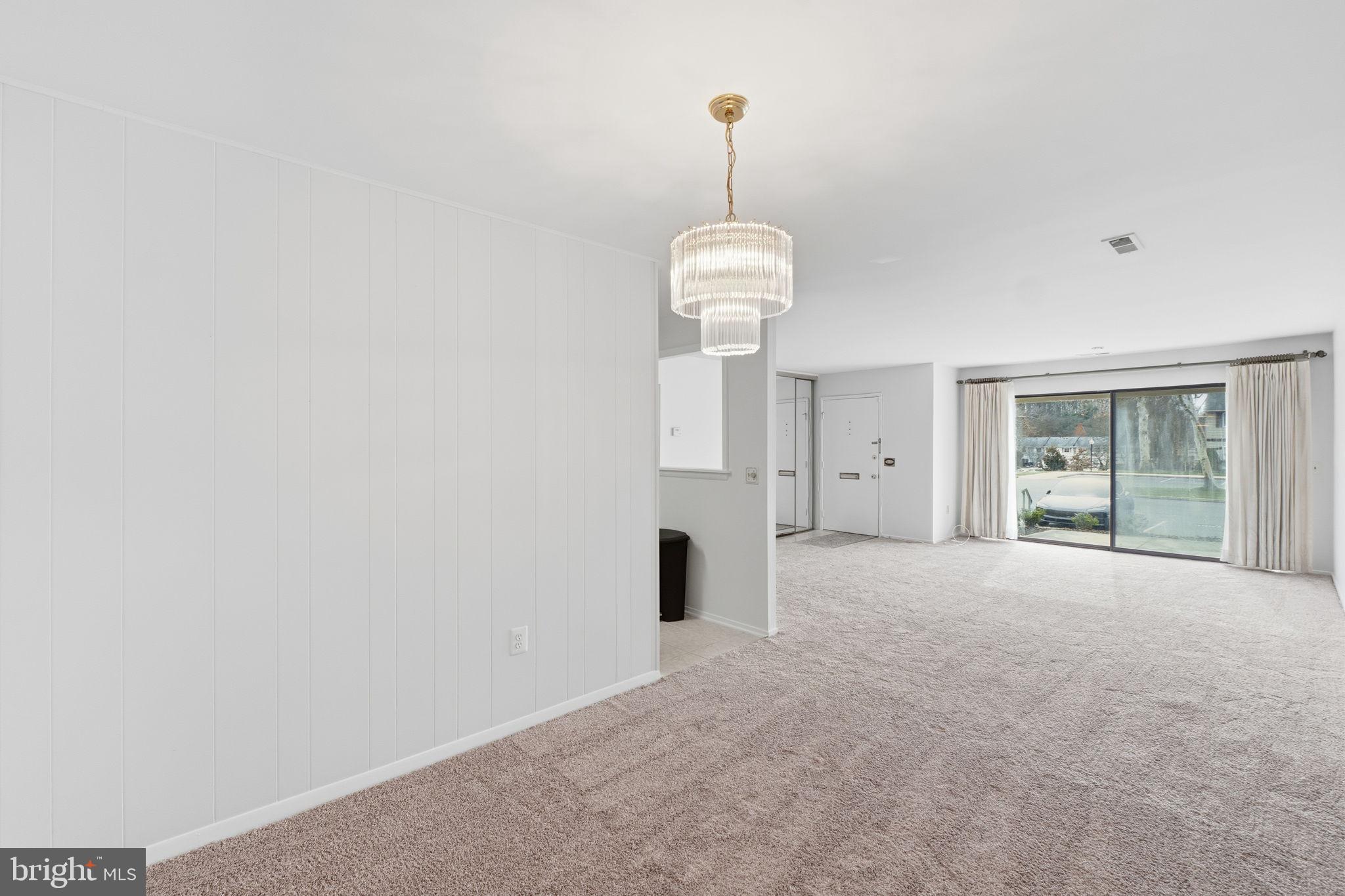 3103 Beckenham Court, Unit 252D Silver Spring, MD 20906 - Photo 6 of 32 a view of empty room with windows and ceiling fan