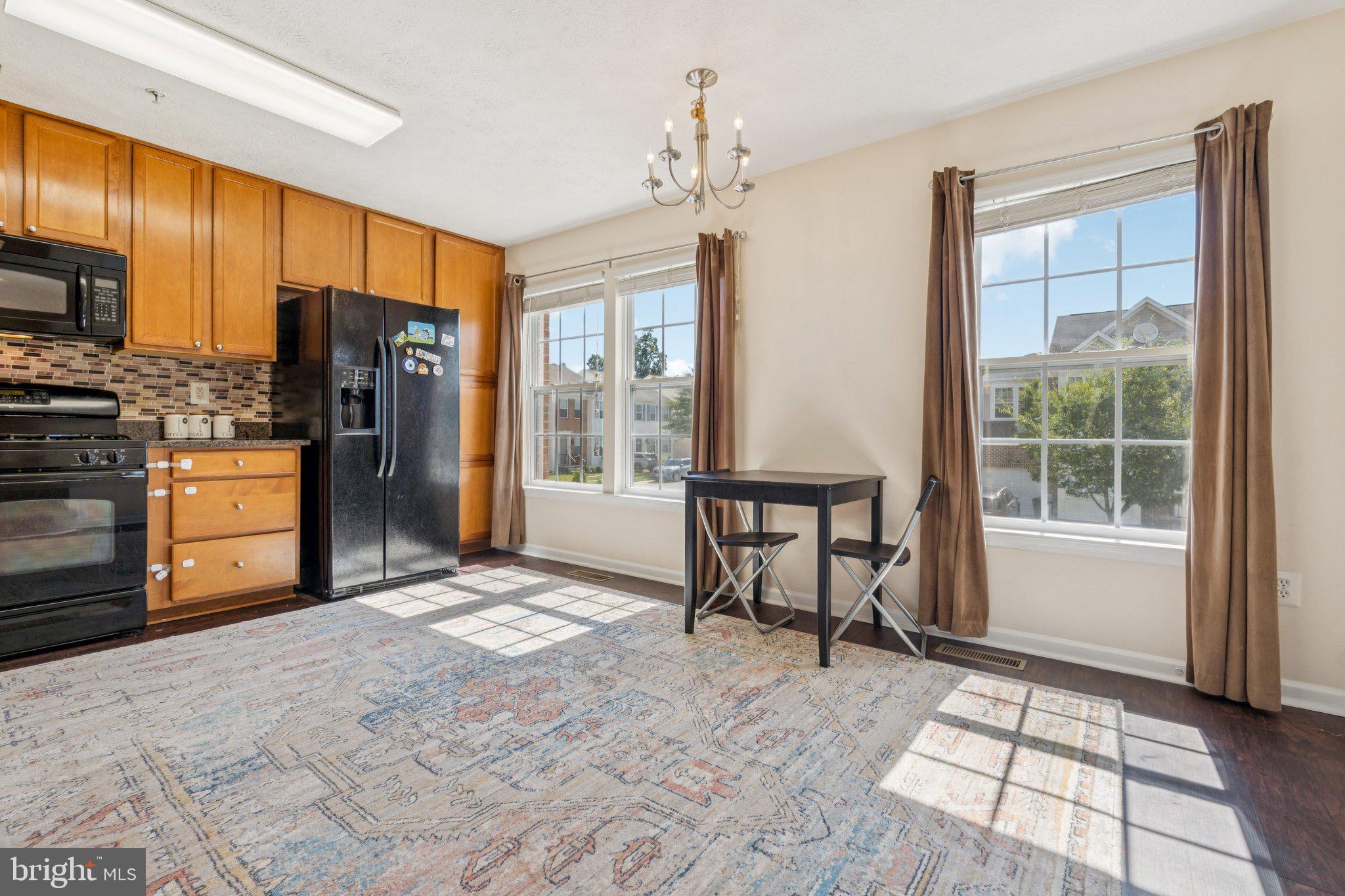 9740 Biggs Road Middle River, MD 21220 - Photo 12 of 37 a view of a kitchen with furniture and a window