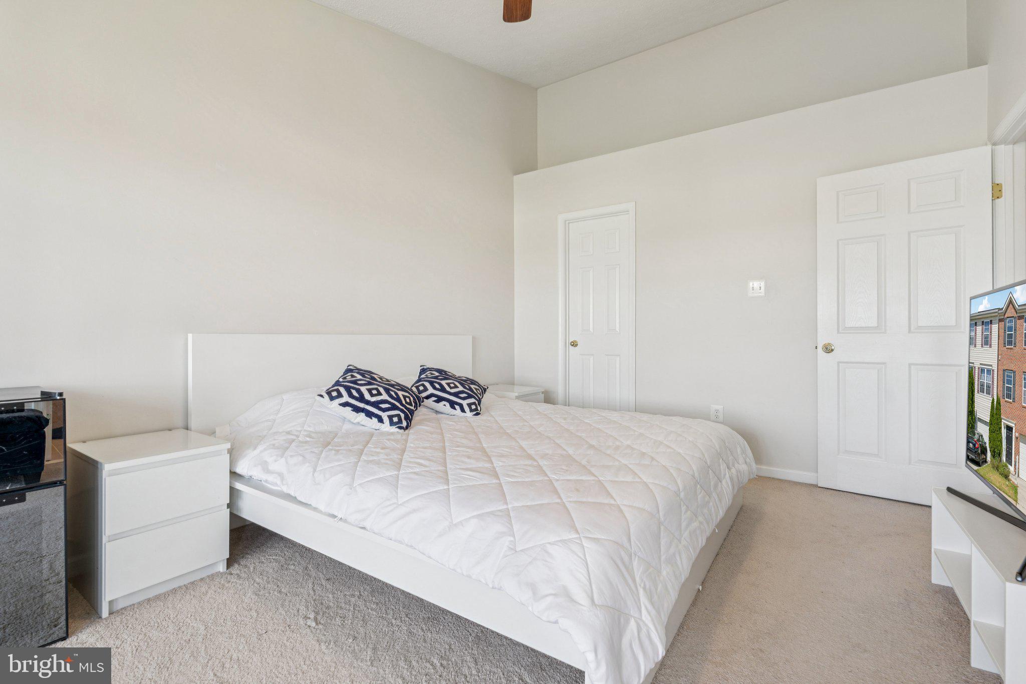 9740 Biggs Road Middle River, MD 21220 - Photo 17 of 37 a bedroom with a bed and a couch