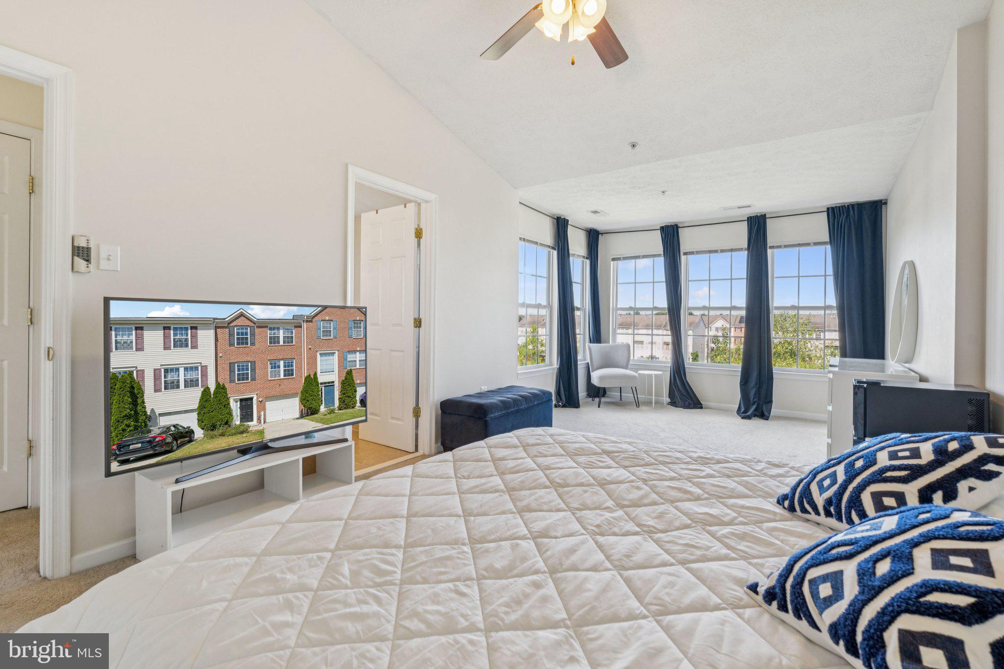 9740 Biggs Road Middle River, MD 21220 - Photo 19 of 37 a bedroom with a bed and glass walk in closet