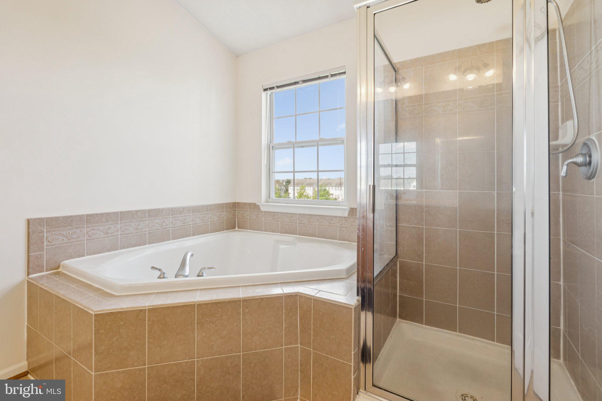 9740 Biggs Road Middle River, MD 21220 - Photo 23 of 37 a white bath tub sitting next to a shower