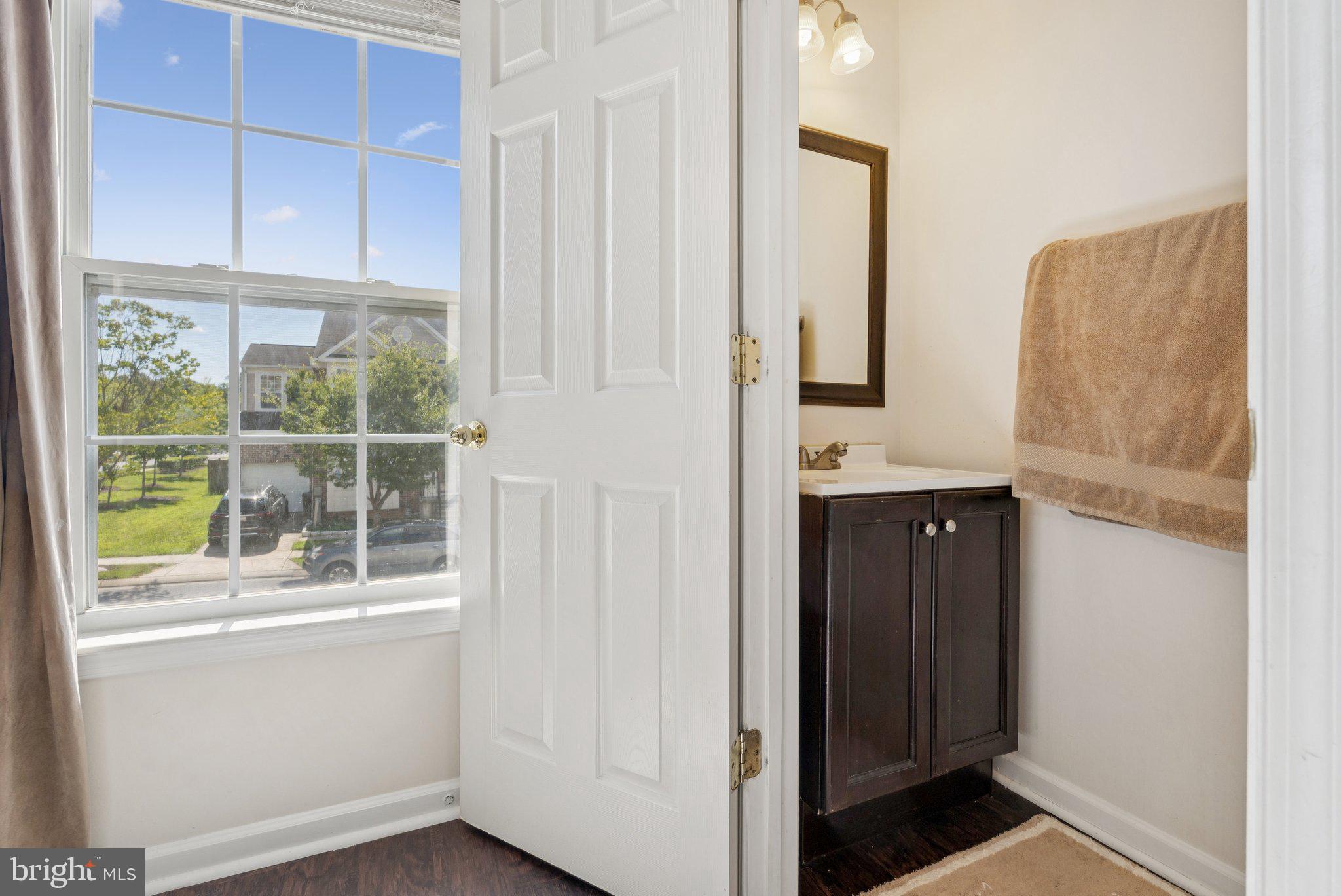 9740 Biggs Road Middle River, MD 21220 - Photo 24 of 37 a bathroom with a window and a shower
