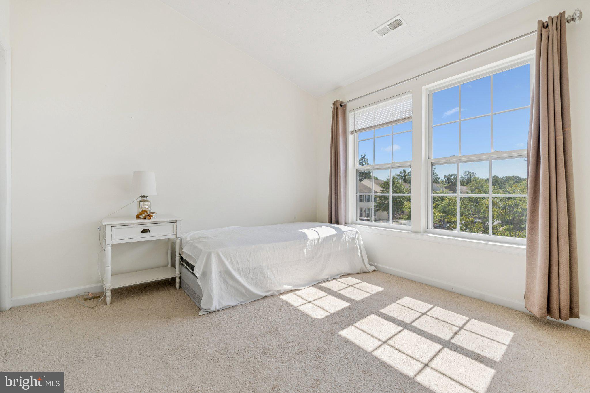 9740 Biggs Road Middle River, MD 21220 - Photo 25 of 37 a bed room with a bed and a window