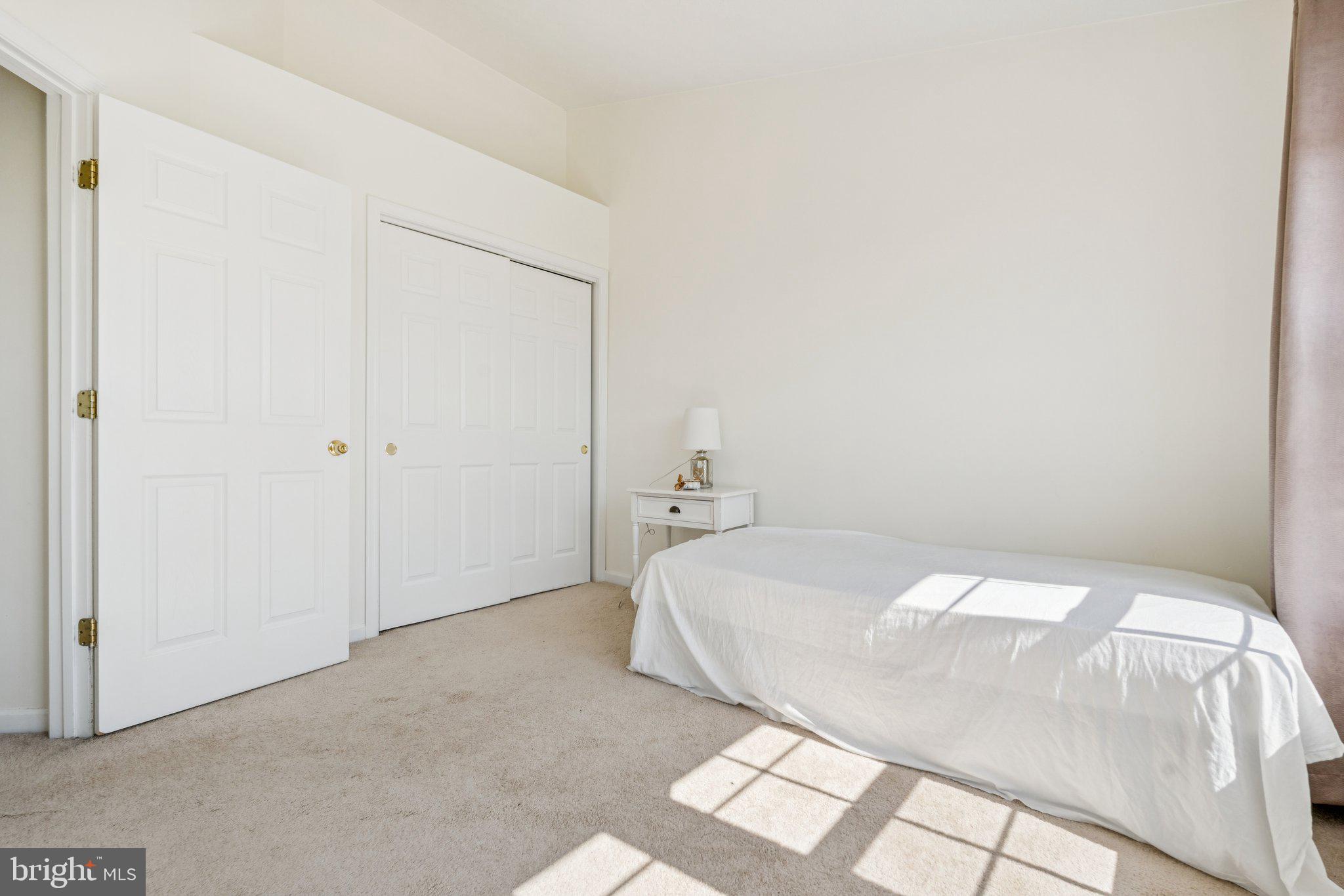 9740 Biggs Road Middle River, MD 21220 - Photo 26 of 37 a bedroom with a bed and a window