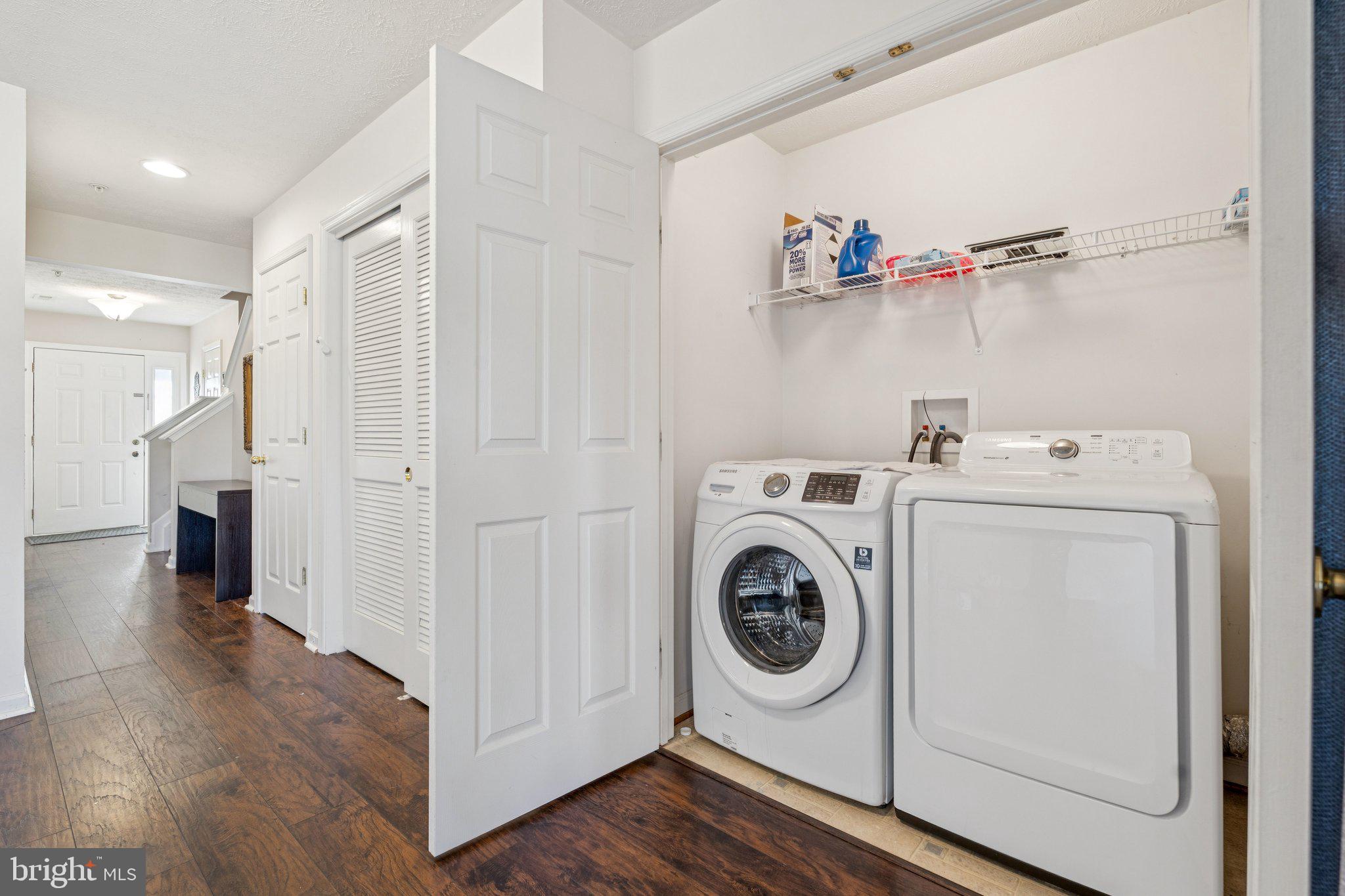 9740 Biggs Road Middle River, MD 21220 - Photo 32 of 37 a view of washer and dryer with wooden floor