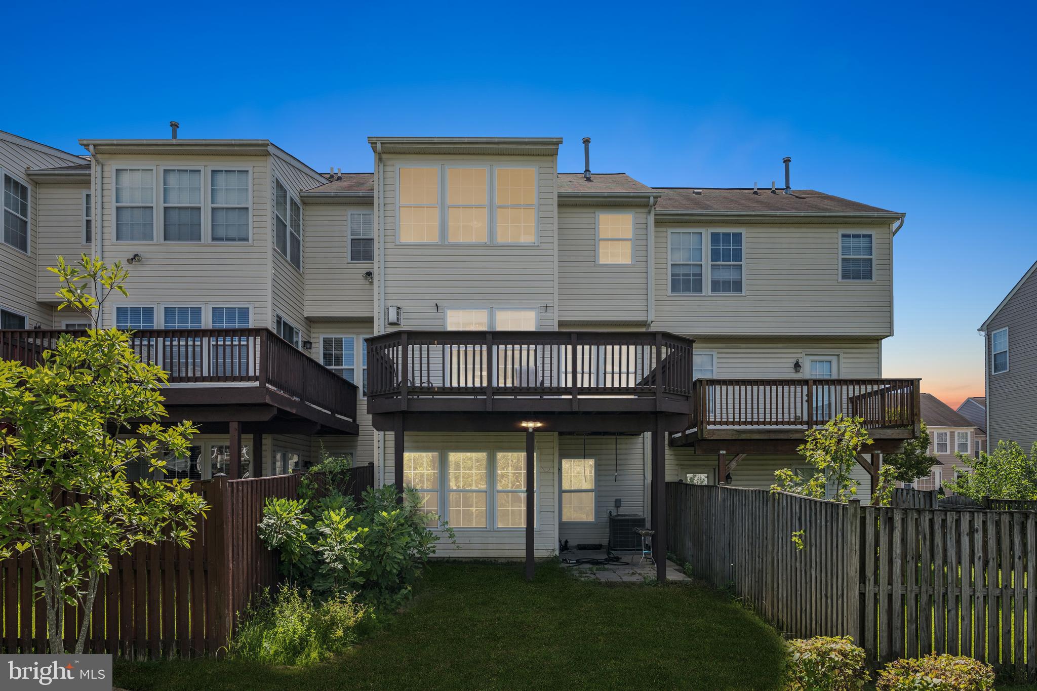 9740 Biggs Road Middle River, MD 21220 - Photo 35 of 37 a view of a house with wooden deck and furniture