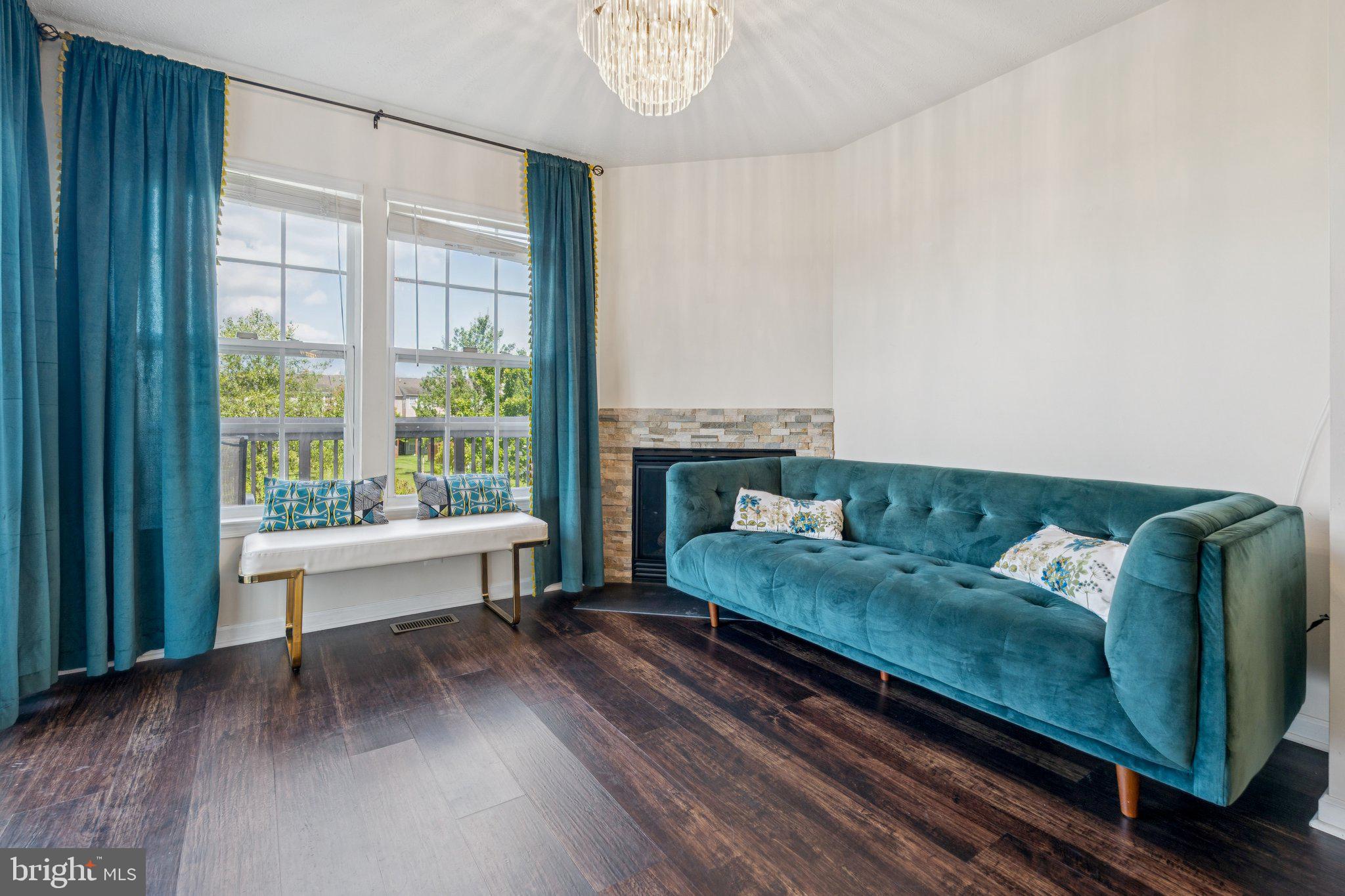 9740 Biggs Road Middle River, MD 21220 - Photo 5 of 37 a living room with furniture and a fireplace