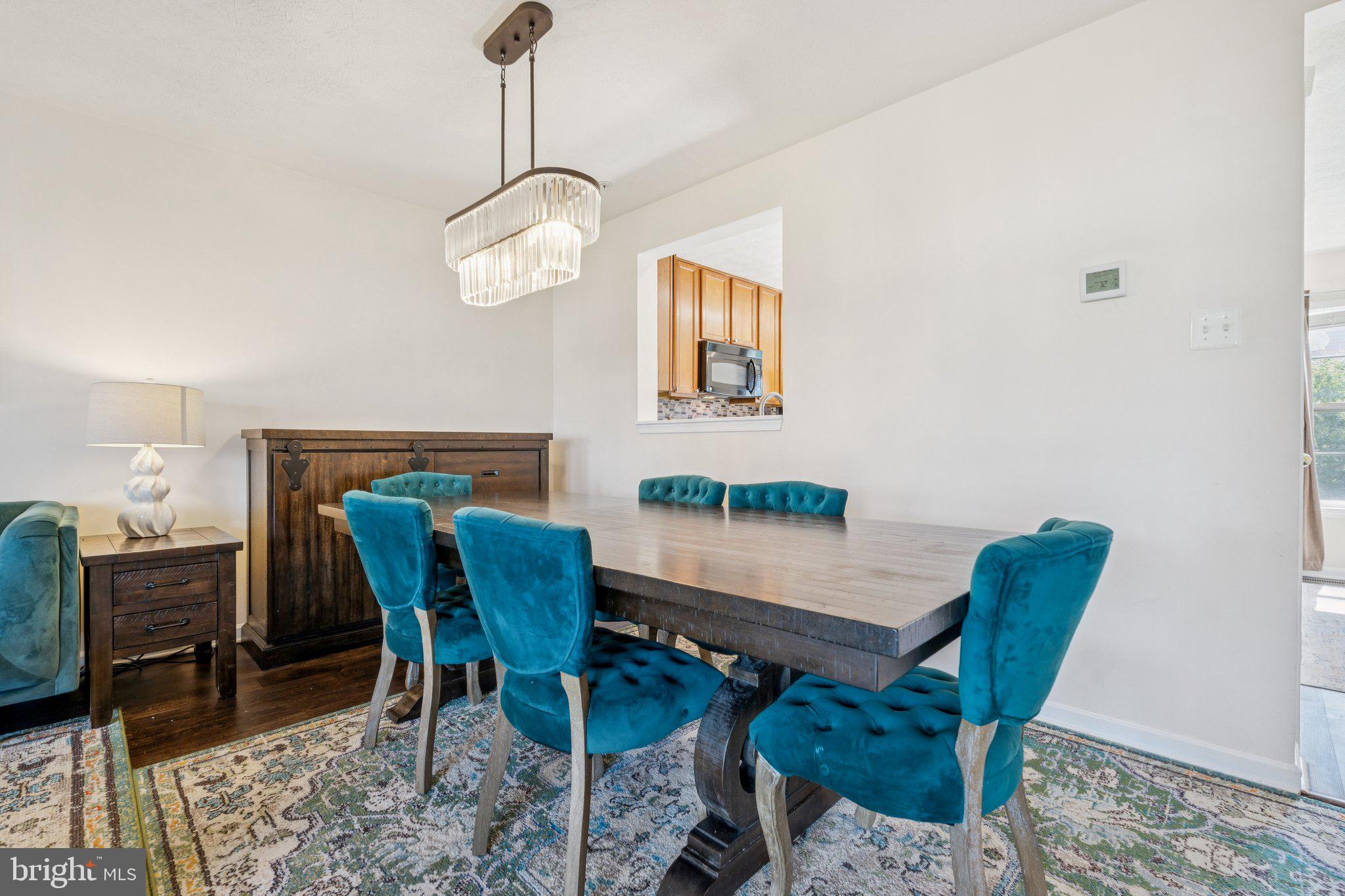 9740 Biggs Road Middle River, MD 21220 - Photo 6 of 37 a view of a dining room with furniture and wooden floor