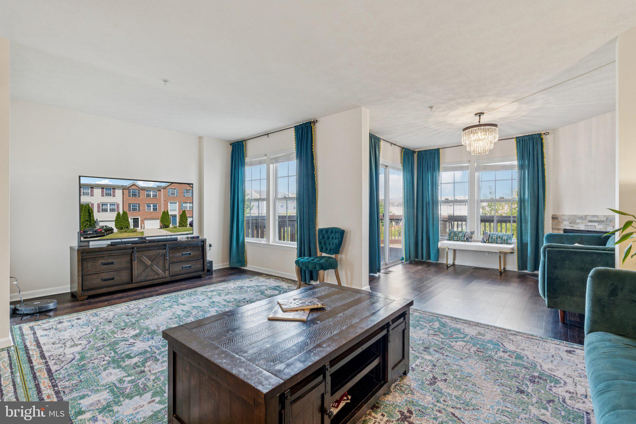 9740 Biggs Road Middle River, MD 21220 - Photo 8 of 37 a living room with furniture and a flat screen tv