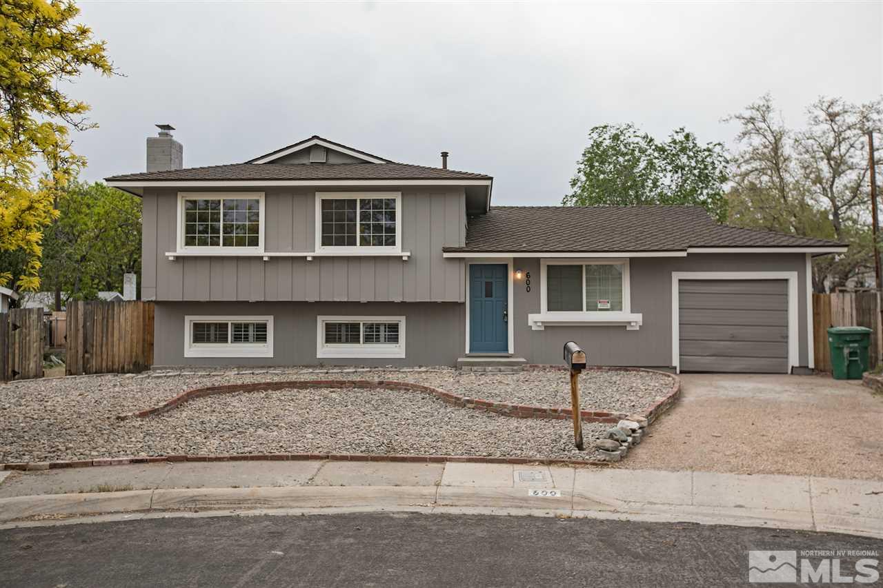 600 Akard Circle Reno, NV 89503 - Photo 1 of 25 a front view of a house with a garden and yard