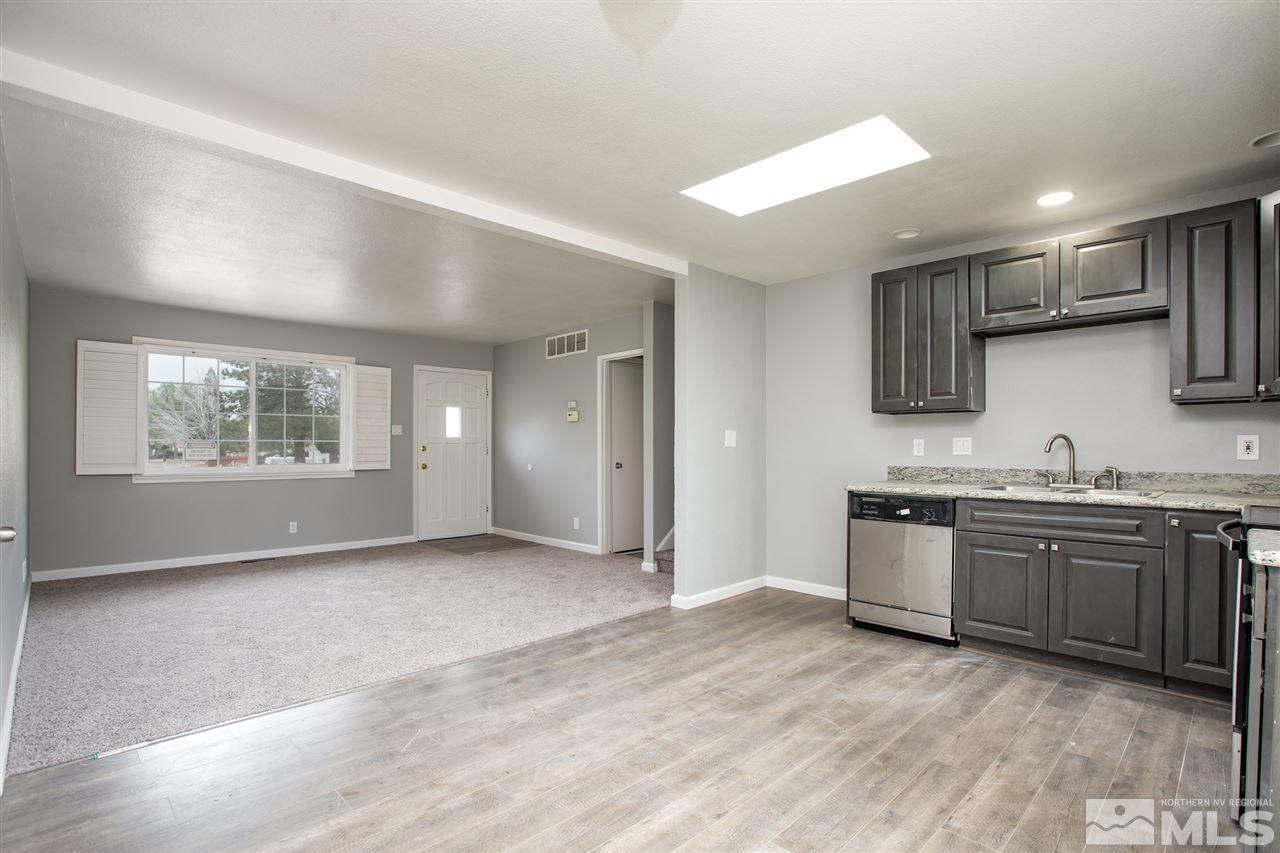 600 Akard Circle Reno, NV 89503 - Photo 12 of 25 a view of a kitchen with stainless steel appliances granite countertop a stove and a sink