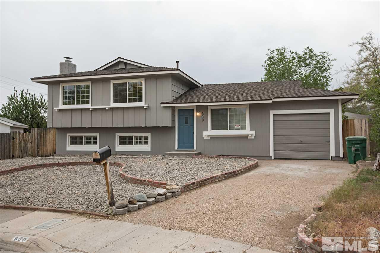 600 Akard Circle Reno, NV 89503 - Photo 2 of 25 a front view of a house with garage and yard