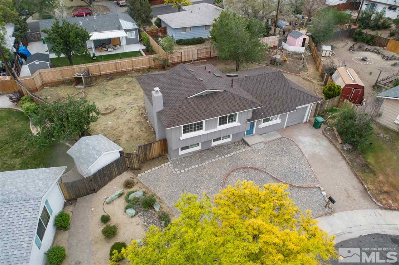 600 Akard Circle Reno, NV 89503 - Photo 6 of 25 an aerial view of a house with swimming pool and large trees