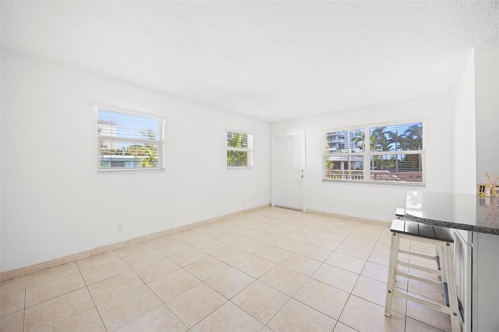 2131 North Ocean Boulevard, Unit 17 Fort Lauderdale, FL 33305 - Photo 11 of 27 an empty room with windows