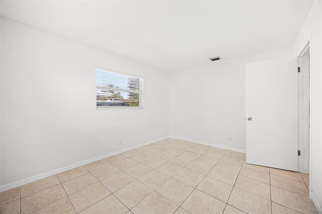 2131 North Ocean Boulevard, Unit 17 Fort Lauderdale, FL 33305 - Photo 14 of 27 an empty room with white walls