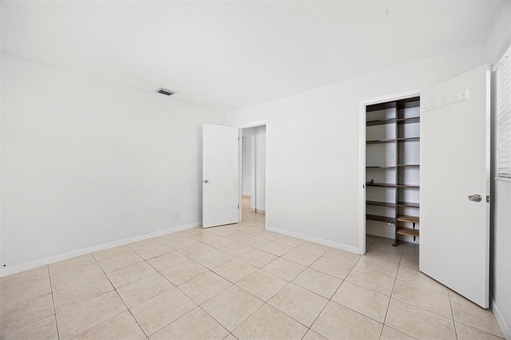 2131 North Ocean Boulevard, Unit 17 Fort Lauderdale, FL 33305 - Photo 15 of 27 an empty room with cabinet
