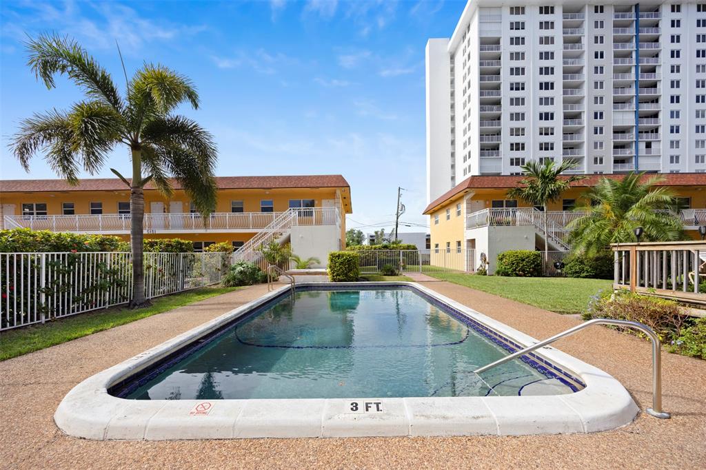 2131 North Ocean Boulevard, Unit 17 Fort Lauderdale, FL 33305 - Photo 21 of 27 a view of outdoor space yard and swimming pool