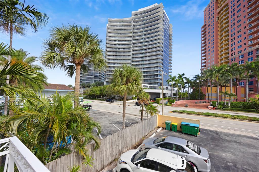 2131 North Ocean Boulevard, Unit 17 Fort Lauderdale, FL 33305 - Photo 26 of 27 a small garden with tall trees