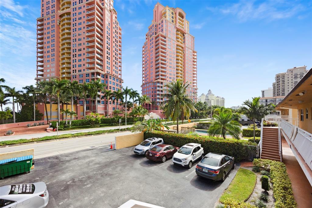 2131 North Ocean Boulevard, Unit 17 Fort Lauderdale, FL 33305 - Photo 27 of 27 a backyard of a house with barbeque oven and a fire pit
