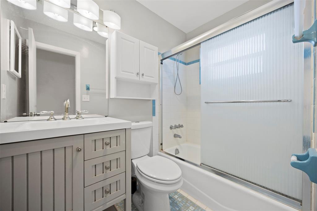 2131 North Ocean Boulevard, Unit 17 Fort Lauderdale, FL 33305 - Photo 6 of 27 a bathroom with a sink a toilet a mirror and shower