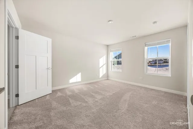 a view of empty room with windows